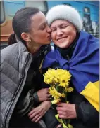  ?? ?? JOY: Anastasia kisses mother Oksana as the ‘Victory Train’ arrives in Kherson