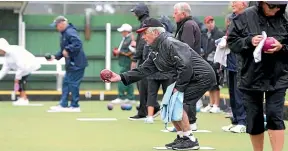  ?? JOHN BISSET/STUFF ?? Wet weather gear was the order for the day at the Temuka 3000 bowls tournament yesterday. But a little water was never going to keen them off the greens. Pictured is John Burridge of Geraldine.