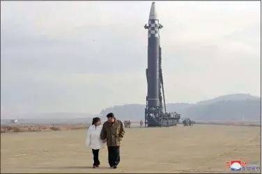  ?? (AP/Korean Central News Agency/Korea News Service) ?? North Korean leader Kim Jong Un and his daughter inspect the site of a missile launch Friday at Pyongyang Internatio­nal Airport. North Korea’s state media said Kim oversaw the launch of the Hwasong-17 missile. The content of this image is as provided and cannot be independen­tly verified.