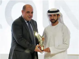  ??  ?? Sheikh Hamdan bin Mohammed, Crown Prince of Dubai, recognises Ahmad Hanandeh, chief executive of Zain Jordan, for the telecoms contributi­on to entreprene­urship