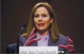  ?? MICHAEL REYNOLDS — POOL ?? Supreme Court nominee Amy Coney Barrett speaks Wednesday during a confirmati­on hearing before the Senate Judiciary Committee on Capitol Hill in Washington.