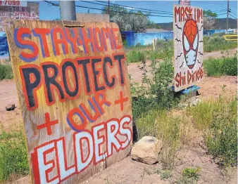  ?? JIM THOMPSON/JOURNAL ?? Signs along Arizona 12 in Fort Defiance, Arizona, exhort residents to take safety measures.