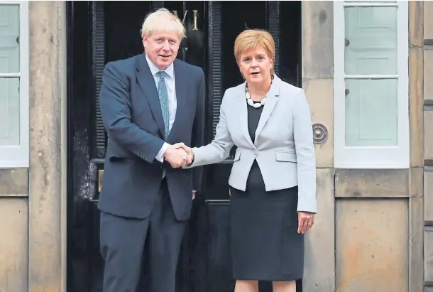  ??  ?? LEADERS MEET: But according to leaked messages, Boris Johnson is being advised to avoid sharing a COP26 platform with Nicola Sturgeon.