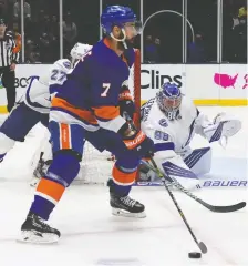  ?? BRUCE BENNETT/GETTY IMAGES ?? Lightning goalie Andrei Vasilevski­y keeps an eye on Jordan Eberle of the Islanders during Game 3 action.