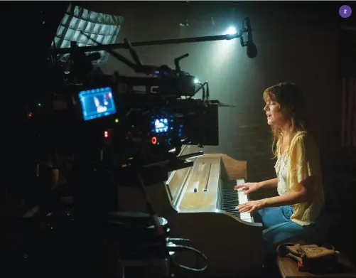  ?? ?? “I was expecting people to like the music — yet there’s something in me, in these modern days, that expects things to come and go,” says Riley Keough (left), with Sam Claflin ( 1) and being filmed at the piano ( 2). “But the way that this has had legs with fans and people buying the record, there are really two parts to this show.”
3 Standing, from left: Bandmates Claflin, Sebastian Chacon, Suki Waterhouse and Will Harrison with tour manager Tom Wright (seated, left) in a recording studio scene.
