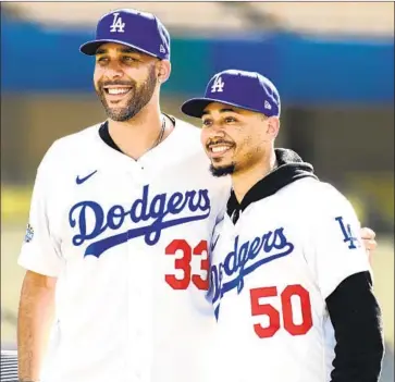  ?? Christina House Los Angeles Times ?? BOSTON TRADED pitcher David Price, left, and outfielder Mookie Betts, right, to the Dodgers in a move the Red Sox say wasn’t financiall­y motivated, but fans apparently aren’t believing that.