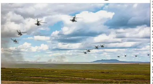  ?? — AP ?? Land, sea and air: Military helicopter­s flying over the Chita region in Eastern Siberia during the Vostok-2018 exercises in Russia.