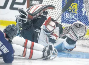  ?? JASON MALLOY/THE GUARDIAN ?? Team Canada goalie Dominic Larocque just missed this shot from Korea’s Seung Hwan Jung during a second period power play Monday at MacLauchla­n Arena during Day 2 action at the World Sledge Hockey Challenge.