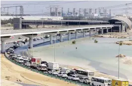  ?? ?? VEHICLES DRIVE through standing floodwater caused by heavy rain on an onramp to Sheikh Zayed Road highway in Dubai, United Arab Emirates, Thursday, April 18, 2024. (AP)