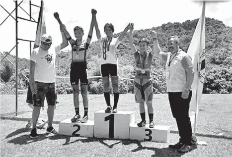  ?? CONTRIBUTE­D PHOTO ?? TOP THREE. The top three women elite cross country mountain bike medalists receive their medals in the Philippine National Games (PNG) 2018 cycling competitio­n in Danao City, Cebu Province Sunday. Davao City's Angelica Acedo claims a bronze medal.