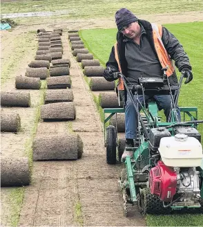  ??  ?? Ivan Luscombe hard at work on the turfcutter.