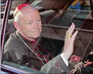  ?? ANDREW MEDICHINI/AP PHOTO ?? Cardinal Theodore McCarrick of the Archdioces­e of Washington waves as he arrives at the Vatican in a limousine April 23, 2002. On Saturday, the Vatican announced Pope Francis had defrocked McCarrick after Vatican officials found him guilty of soliciting for sex while hearing Confession.