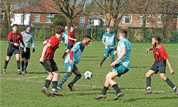  ?? ?? ●●Poynton JFC (in red) against Hooley Bridge Celtic during the weekend’s round of Lancashire and Cheshire League matches