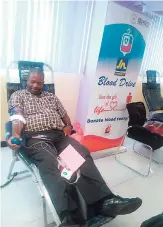  ?? CONTRIBUTE­D ?? Andrew Green of Jamaica National donating at the recent Jamaica National Blood Drive.