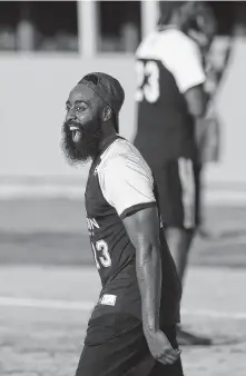  ??  ?? The Rockets’ James Harden looks as comfortabl­e on the softball field as he does at the 3-point arc at Toyota Center.
