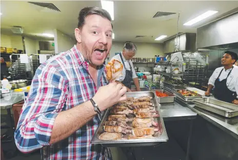  ?? Picture: MIKE BATTERHAM ?? Celebrity chef Manu Feildel hams it up at the Pan Pacific Pork Expo at Broadbeach.