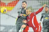  ?? AP ?? Liverpool's Thiago vies for the ball with Manchester United's Bruno Fernandes (left) during Sunday’s game at Anfield.