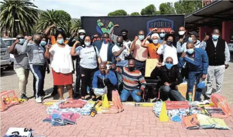  ?? Picture: ZINTLE BOBELO ?? FORWARD WITH SPORT: Certified female soccer referee Akhona Makalima and Patrick Selepe of Wheelchair Tennis SA, who are part of the Global Sports Mentorship Programme, donated sports equipment to eight schools last week