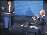  ?? MORRY GASH — AP, POOL ?? President
Donald Trump and Democratic presidenti­al candidate former Vice President Joe Biden exchange points during the first presidenti­al debate Tuesday.