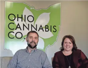  ?? SARA C. TOBIAS/THE ADVOCATE ?? Brian Wingfield and Cindy Bradford, co-owners of Ohio Cannabis Company, sit in the lobby of the Coshocton company.
