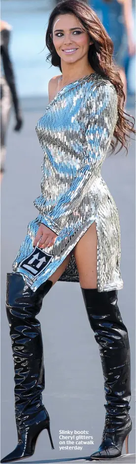  ??  ?? Slinky boots: Cheryl glitters on the catwalk yesterday