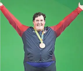  ?? JASON GETZ/USA TODAY SPORTS ?? Sarah Robles celebrates after winning a bronze medal during the 2016 Rio Summer Olympic Games.