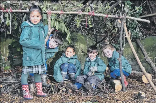  ??  ?? GREAT OUTDOORS: Pupils at the independen­t Westbourne School in Sheffield enjoy an outdoor lesson as the school adopts the ‘Forest School’ approach to learning.