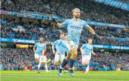  ?? /Robbie Jay Barratt/Getty Images ?? Serial scorer: Sergio Aguero celebrates the first of his hat-trick against Arsenal at the weekend.