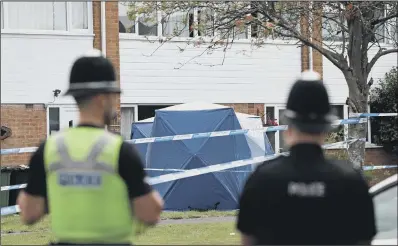  ??  ?? SEARCH FOR CLUES: Police forensic tents outside a house in Solihull after a mother aged 49 and her 22-year-old daughter were stabbed to death.