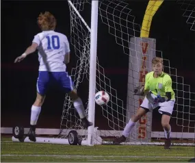  ?? PETE BANNAN — MEDIANEWS GROUP ?? Great Valley’s Matthew Wellener fires on West Chester East goalie Johnny Regester Tuesday night.