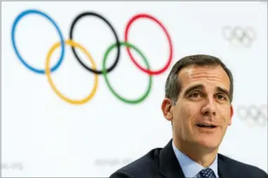 ?? JEAN-CHRISTOPHE BOTT — THE ASSOCIATED PRESS ?? Mayor of Los Angeles Eric Garcetti speaks earlier this month in Switzerlan­d. It was announced Monday that Los Angeles has reached an agreement with internatio­nal Olympic leaders that will open the way for the city to host the 2028 Summer Games, while...