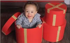  ?? Photo courtesy of Kyla Kelly ?? Kyla Kelly’s son Cash sits in a Christmas box at 1 ½ years old.