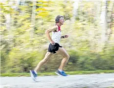  ?? BOB TYMCZYSZYN/POSTMEDIA NEWS ?? Fonthill resident Stuart Galloway goes for a run along a pathway this past weekend. The 56-year-old long-time runner won the full marathon at the Niagara Falls Internatio­nal Marathon earlier this month.