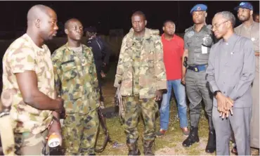  ??  ?? Governor Nasir El-Rufai of Kaduna State interacts with soldiers at the crises area in Kaduna yesterday.