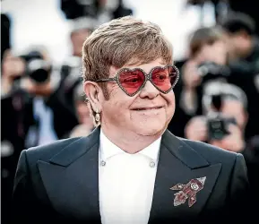  ??  ?? Every media move in the Elton John repertoire these days consciousl­y invokes a historical point 40 years ago when John released a slew of albums.