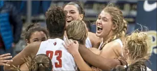  ?? Alexandra Wimley/Post-Gazette ?? Peters Township players celebrate the Class 6A girls championsh­ip.