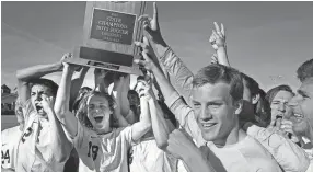  ??  ?? Houston High School players celebrate their win over Science Hill in the 2015 AAA soccer finals.