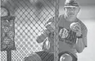  ??  ?? Tipton Rosemark Academy coach Johnie Sanfratell­o conducts batting practice Wednesday.