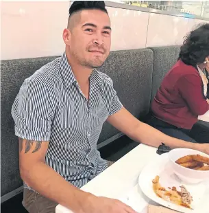  ?? HEATHER SCOFFIELD TORONTO STAR ?? Christian Spence, 29, during his lunch break at the Rideau Centre in downtown Ottawa. Spence works as a project co-ordinator at an Inuit associatio­n and says he is quite comfortabl­e financiall­y.