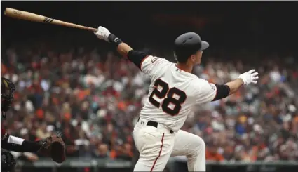  ?? AP PHOTO/BEN MARGOT ?? San Francisco Giants’ Buster Posey swings for a two run home run off Arizona Diamondbac­ks’ Robbie Ray in the fifth inning of a baseball game on Wednesday, in San Francisco.