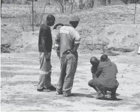  ??  ?? Constructi­on workers on site where a second water reservoir will be erected in Nyamandlov­u