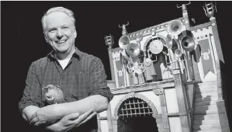  ??  ?? Nick Park holds Hognob, the Early Man character he voices.