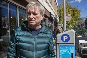  ?? KARL MONDON — STAFF PHOTOGRAPH­ER ?? Kevin Simpson shares his mostly, but not totally, negative opinions about the parking meters in the downtown area of San Mateo on Wednesday. San Mateo has issued 48,650tickets in 2022, an 86% increase from 2019.