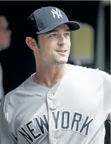  ?? BRUCE KLUCKHOHN/AP ?? Yankees relief pitcher David Robertson enters the dugout Wednesday during a game against the Minnesota Twins. New York acquired Robertson on Tuesday in a trade with the Chicago White Sox.