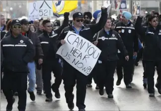  ?? JOHN WOODS, THE CANADIAN PRESS ?? Marching Winnipeg transit workers close down Portage and Main on Friday as they rally for bus driver Irvine Fraser, who was killed in a dispute. The protesters demanded safety improvemen­ts on buses.