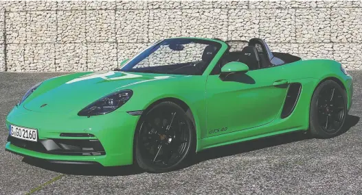  ?? PHOTOS: BRIAN HARPER/DRIVING ?? The 2021 Porsche 718 Boxster GTS 4.0, shown, and its sister car, the Cayman GTS 4.0, both benefit from the return of the six-cylinder boxer engine.