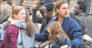  ??  ?? Mireille Enos as Karin and Brad Pitt as Gerald Lane in World War Z