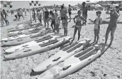  ?? JIM RASSOL/STAFF PHOTOGRAPH­ER ?? Young lifeguards and competitiv­e swimmers participat­e in the iron race competitio­n during the James P. “Mac” McCarthy Memorial Regional Lifesaving Championsh­ips.