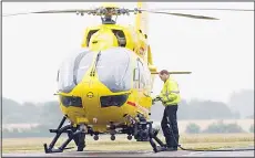  ??  ?? This file photo taken on July 13, 2015 shows Britain’s Prince William, The Duke of Cambridge refueling a helicopter as he begins his new job with the East Anglian Air Ambulance (EAAA) at Cambridge Airport. Britain’s Prince William on July 27, retired...