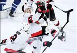  ?? CP PHOTO NATHAN DENETTE ?? Ottawa Senators right wing Evgenii Dadonov (63) scores the game tying goal against the Toronto Maple Leafs during third period NHL hockey action in Toronto on Monday.